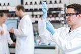 A photograph of a chemist working in a lab