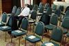 Person asleep in empty conference room