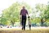 A picture of an old man with a bike