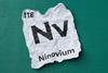 An image showing a scrunched up piece of paper with the details of element 118 - Ninovium - Written down