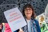 An image showing a woman holding a placard that reads "Without SCIENCE there would be NO CUPCAKES!"