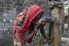 Woman drinking arsenic-contaminated water