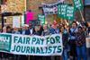 People protesting for fair pay on a picket line